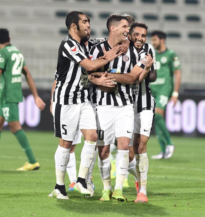 Thiago Neves, centre, and Al Jazira left Maktoum bin Rashid Stadium a happy bunch after a 2-1 win over Al Shabab. Courtesy AGL