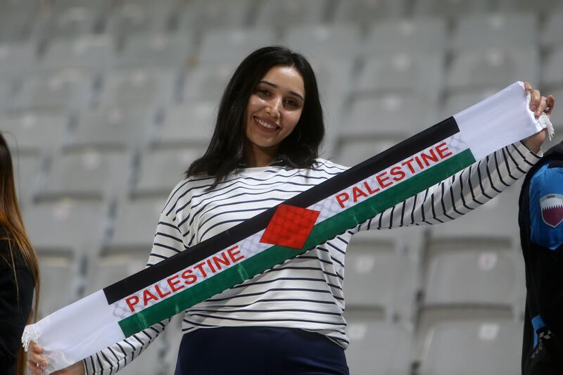 A Palestinian celebrates at the end of the 3-0 victory over Hong Kong. AP 