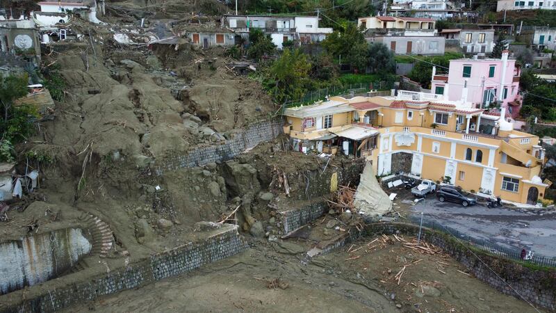 Damaged houses after heavy rainfall triggered landslides that collapsed buildings and left as many as 12 people missing on the Italian island of Ischia. AP