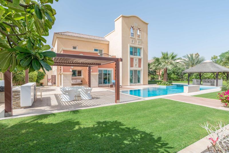 The pool area and garden are as welcoming as any villa development in Dubai. Courtesy LuxuryProperty.com