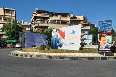 Telecommunications provider Emmatel posts a message of support for Bashar Al Assad ahead of elections in Al Qusour roundabout, Damascus. 