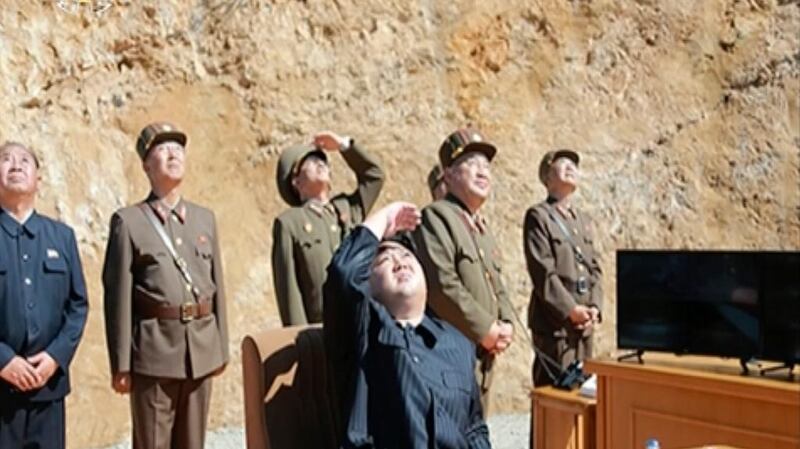 North Korean leader Kim Jong-un watches the launch of a Hwasong-14 intercontinental ballistic missile.