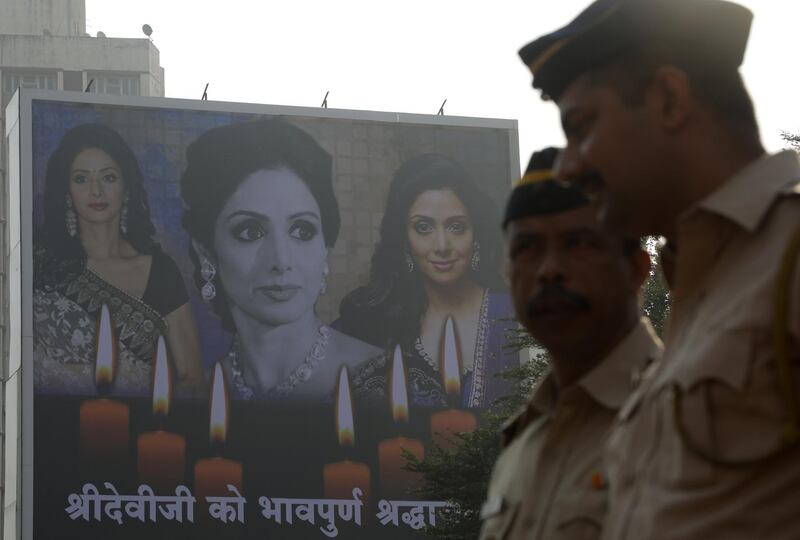 A poster of Sridevi with a condolence message hangs outside the actors residence in Mumbai. Divyakant Solanki / EPA