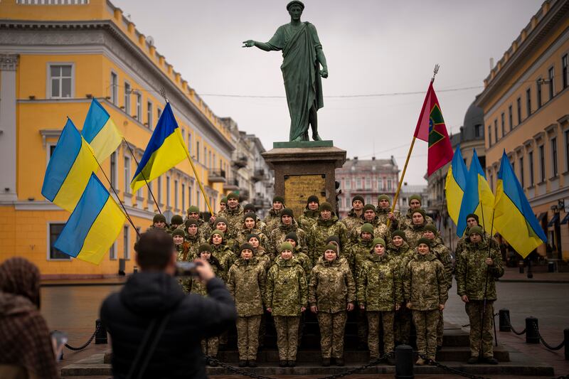 Ukrainian soldiers pose for a picture as the country observes a Day of Unity in Odessa. AP