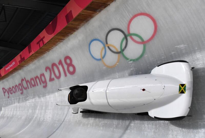 Team leader and driver Jazmine Fenlator-Victorian of Jamaica corners in the second women's unofficial bobsleigh training session at the Olympic Sliding Centre, ahead of the Pyeongchang 2018 Winter Olympic Games, in Pyeongchang on February 8, 2018. / AFP PHOTO / Mark Ralston