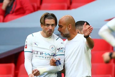 LONDON, ENGLAND - AUGUST 07: Manchester City Manager Pep Guardiola directs Jack Grealish of Manchester City during The FA Community Shield between Manchester City and Leicester City at Wembley Stadium on August 07, 2021 in London, England. (Photo by Chloe Knott - Danehouse / Getty Images)