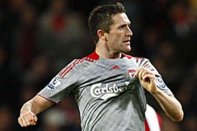 Liverpool's Robbie Keane celebrates his spectacular equaliser during the 1-1 draw with Arsenal at the Emirates.