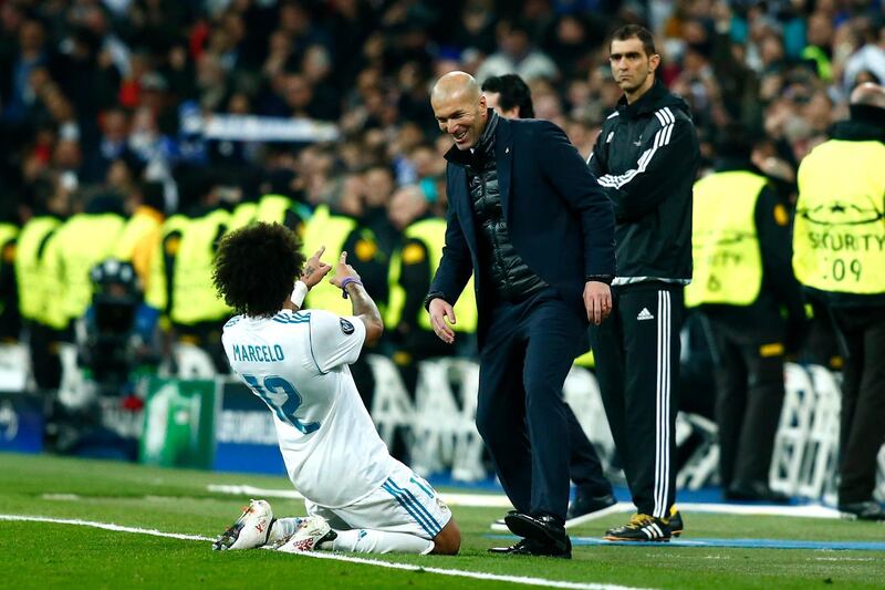 MADRID, SPAIN - FEBRUARY 14:  Marcelo of Real Madrid celebrates scoring the 3rd Real Madrid goal with Zinedine Zidane of Real Madrid during the UEFA Champions League Round of 16 First Leg match between Real Madrid and Paris Saint-Germain at Bernabeu on February 14, 2018 in Madrid, Spain.  (Photo by Gonzalo Arroyo Moreno/Getty Images)