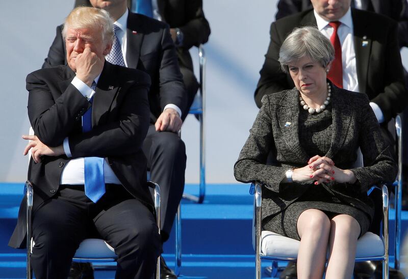 FILE PHOTO: U.S. President Donald Trump and Britain's Prime Minister Theresa May react during a ceremony at the new NATO headquarters before the start of a summit in Brussels, Belgium, May 25, 2017.    REUTERS/Christian Hartmann/File Photo