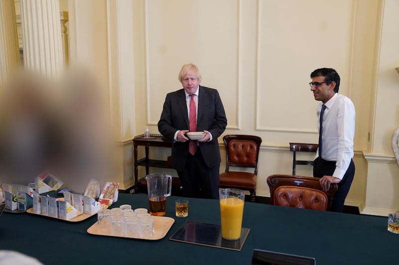 Sue Gray's report included photographs of a gathering for which Boris Johnson was fined. PA