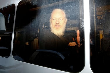 WikiLeaks founder Julian Assange is seen in a police van, after he was arrested by British police, in London, Britain. REUTERS