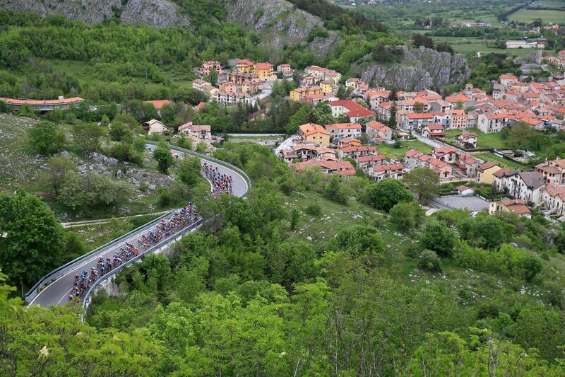 The pack rides past the town of Alfedena. AFP