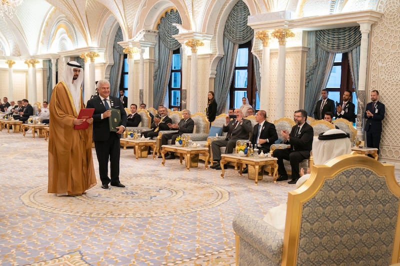 Sheikh Mohamed bin Zayed, Crown Prince of Abu Dhabi and Deputy Supreme Commander of the UAE Armed Forces, and Jair Bolsonaro, President of Brazil, witness the signing of a number of agreements between their countries at the Presidential Palace in Abu Dhabi on Sunday. Courtesy Sheikh Mohamed bin Zayed Twitter