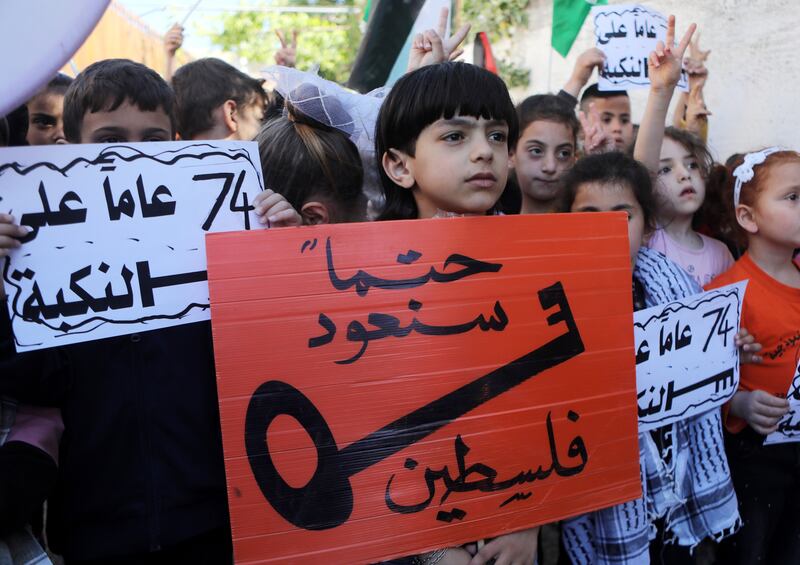 Palestinian children mark the anniversary of the Nakba in the West Bank city of Hebron last year. Millions of Palestinians are descendants of those who lost their homes in 1948 and still seek to return to their ancestral lands. EPA