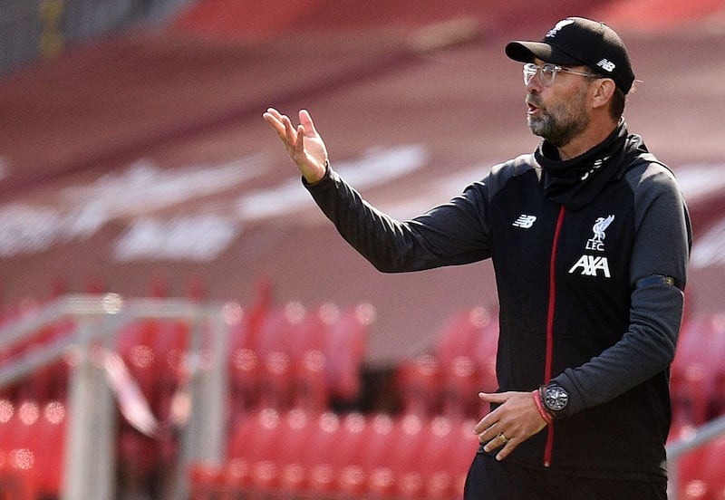 Liverpool's German manager Jurgen Klopp reacts during the English Premier League football match between Liverpool and Burnley at Anfield in Liverpool, north west England on July 11, 2020.  - RESTRICTED TO EDITORIAL USE. No use with unauthorized audio, video, data, fixture lists, club/league logos or 'live' services. Online in-match use limited to 120 images. An additional 40 images may be used in extra time. No video emulation. Social media in-match use limited to 120 images. An additional 40 images may be used in extra time. No use in betting publications, games or single club/league/player publications.
 / AFP / POOL / Oli SCARFF                           / RESTRICTED TO EDITORIAL USE. No use with unauthorized audio, video, data, fixture lists, club/league logos or 'live' services. Online in-match use limited to 120 images. An additional 40 images may be used in extra time. No video emulation. Social media in-match use limited to 120 images. An additional 40 images may be used in extra time. No use in betting publications, games or single club/league/player publications.
