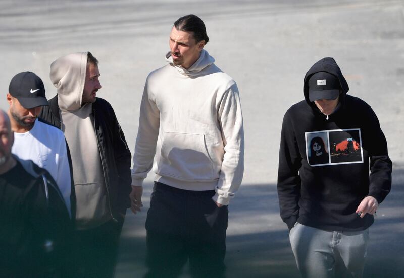 Zlatan Ibrahimovic talks with fans as he leaves the Arsta IP training ground in Stockholm after participating in a training session with the Swedish club Hammarby. EPA