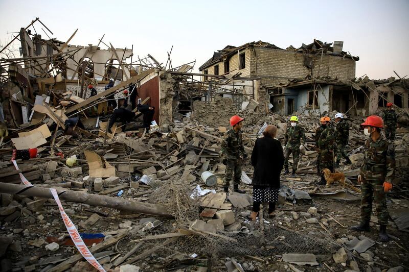 Search and rescue teams work on a blast site hit by a rocket during the fighting over the breakaway region of Nagorno-Karabakh, in the city of Ganja, Azerbaijan. Reuters