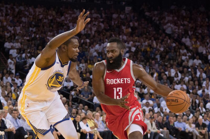 October 17, 2017; Oakland, CA, USA; Houston Rockets guard James Harden (13) dribbles the basketball against Golden State Warriors forward Kevin Durant (35) during the first quarter at Oracle Arena. Mandatory Credit: Kyle Terada-USA TODAY Sports