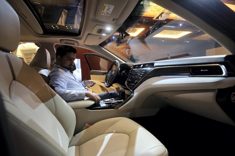 Dubai, June, 03, 2018:  Visitor take a look at the  interiors of the new Toyota Camry HEV ( HYBRID ) which was unveiled for the first time in the UAE in Dubai. Satish Kumar for the National / Story by Adam Workman