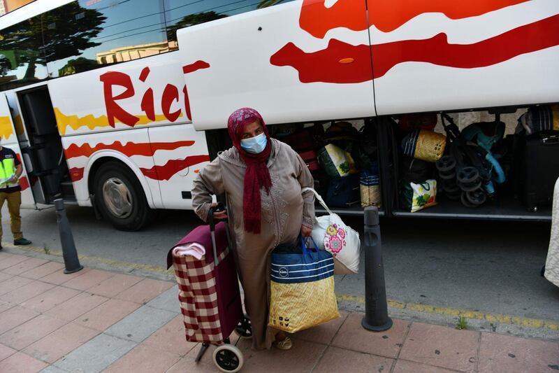 A woman arrives to take a coach to be repatriated  in the Spanish enclave of Ceuta.  AFP