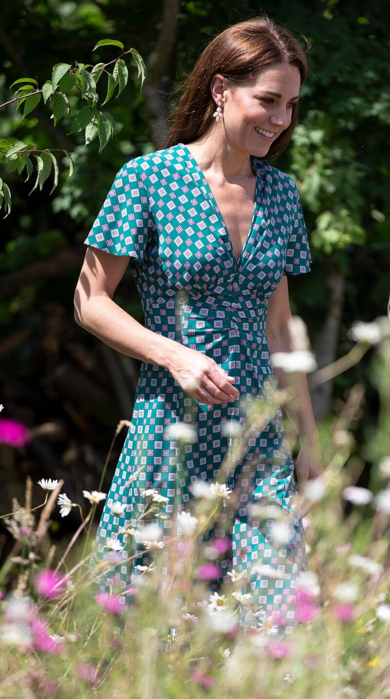 LONDON, ENGLAND - JULY 01: Catherine, Duchess of Cambridge visits the Hampton Court Flower Festival with children from Hampton Hill junior school at Hampton Court Palace on July 1, 2019 in London, England. The Duchess visits her Back to Nature Garden at Hampton Court Palace Garden Festival that she co designed with AndrÃ©e Davies and Adam White (Photo by Heathcliff O'Malley - WPA Pool/Getty Images)