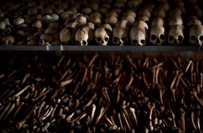 FILE - In this Friday, April 4, 2014 file photo, the skulls and bones of some of those who were slaughtered as they sought refuge inside the church are laid out as a memorial to the thousands who were killed in and around the Catholic church during the 1994 genocide in Ntarama, Rwanda. Felicien Kabuga, one of the most wanted fugitives in Rwanda's 1994 genocide who had a $5 million bounty on his head, has been arrested in Paris, authorities said Saturday, May 16, 2020. (AP Photo/Ben Curtis, File)