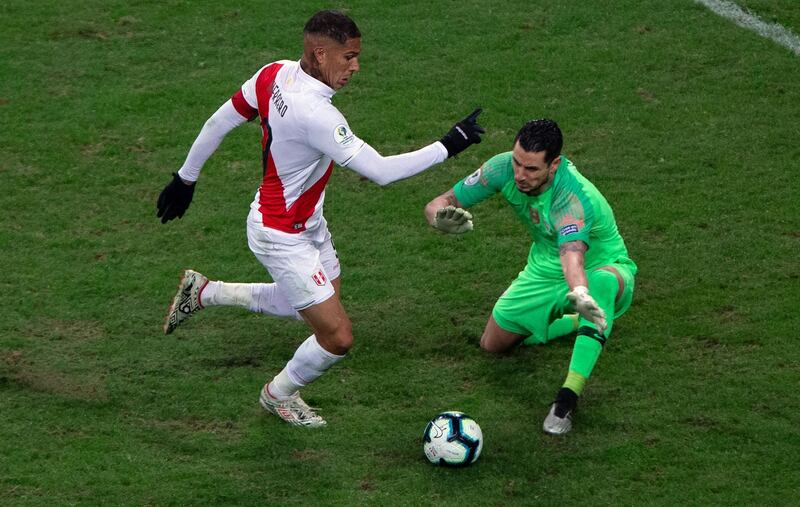 Peru's Paolo Guerrero eludes Chile's goalkeeper Gabriel Arias to score the team's thrid goal during their Copa America football tournament semi-final match at the Gremio Arena in Porto Alegre, Brazi. Peru won 3-0. AFP