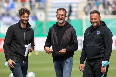 Hertha Berlin sporting director Fredi Bobic, centre, sacked manager Pal Dardai, right, earlier in the season. Getty