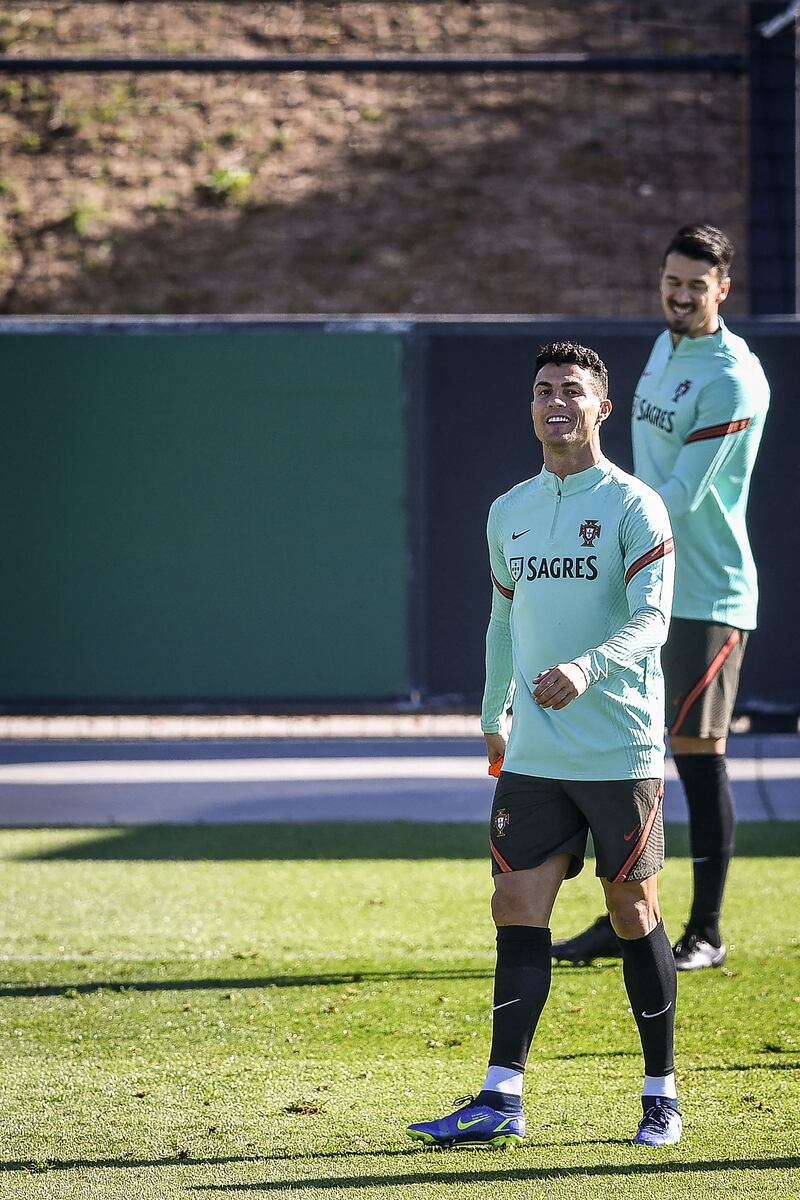 Cristiano Ronaldo in a relaxed mood during training at the Cidade do Futebol training camp in Oeiras. AFP