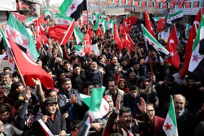 Protestors chant slogans and hold flags during a protest in support of the Turkish army and Turkey-backed Syrian rebels, in Azaz, Syria, March 2, 2020. REUTERS/Khalil Ashawi