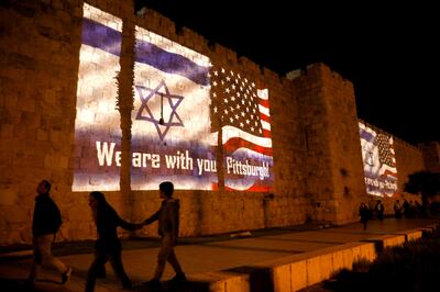 An image of Israeli and American flags with the wording, "We are with you - Pittsburgh" is projected on the walls of Jerusalem's Old City, in solidarity with the victims of a synagogue shooting in Pittsburgh October 28, 2018. REUTERS/Ronen Zvulun
