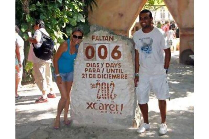 These tourists in Mexico don't look very concerned about the Mayan end-of-the-world prediction - and neither are the readers who sent us letters on the issue. Israel Leal / AP