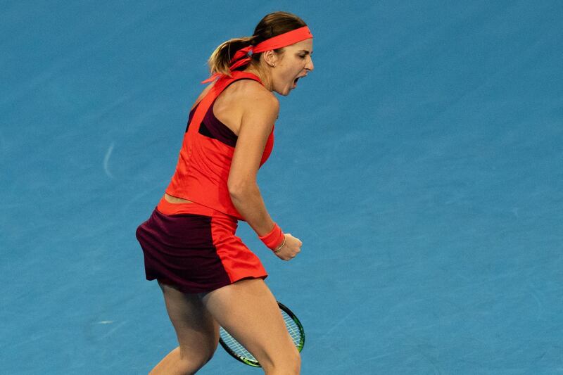 Belinda Bencic of Switzerland celebrates winning a set. EPA