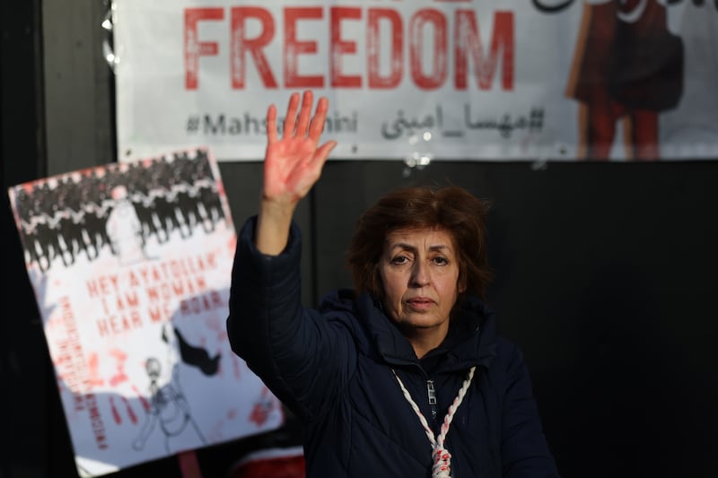 A woman takes part in a demonstration against the Iranian regime in London. Getty