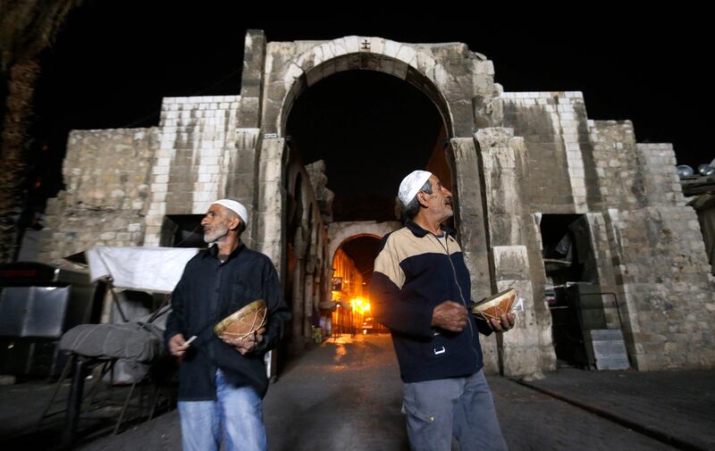 Dawn awakeners known as musaharatis beat drums to wake Muslims for the suhour meal before the day's Ramadan fast in Damascus, Syria. AFP