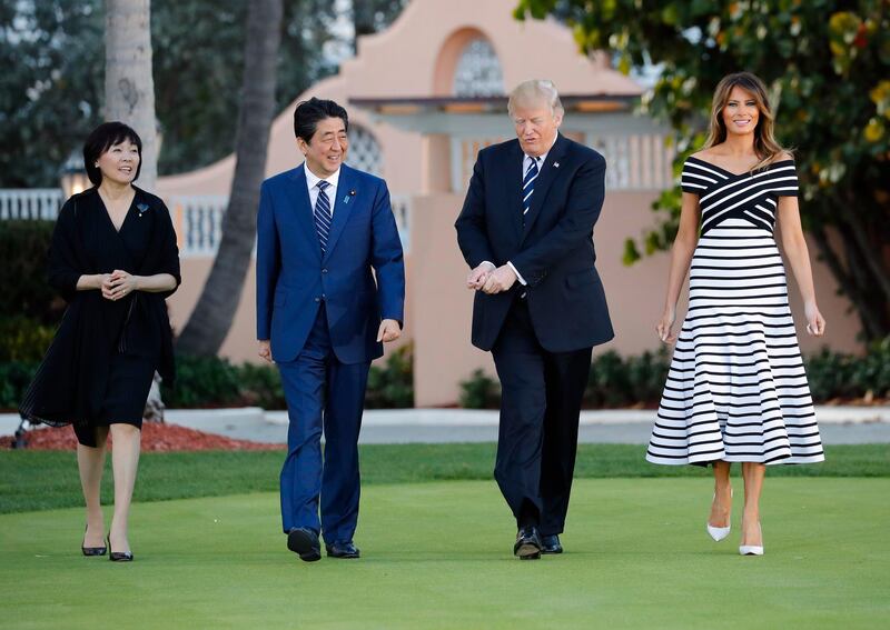 Shinzo Abe, centre left, and his wife Akie Abe, left, US President Donald Trump and first lady Melania Trump at Mr Trump's private Mar-a-Lago club, in Palm Beach, Florida on April 17, 2018. Prime Minister Abe said Friday, Aug. 28, 2020, he will step down due to his health. Pablo Martinez Monsivais / AP