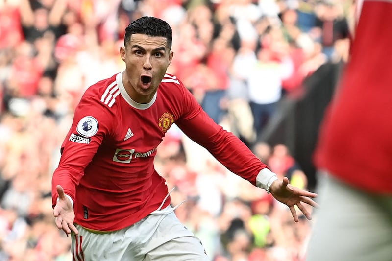 Manchester United striker Cristiano Ronaldo celebrates his 50th club career hat-trick against Norwich City at Old Trafford on April 16, 2022. AFP