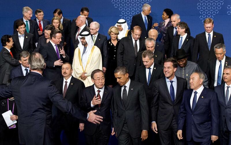 Sheikh Mohammed bin Zayed, Crown Prince of Abu Dhabi and Deputy Supreme Commander of the Armed Forces, centre, chats with UK prime minister, David Cameron, as the US president Barack Obama and the UN secretary general Ban Ki-moon prepare to leave with other world leaders. Robin Van Lonkhuijsen / AFP