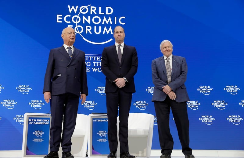 Klaus Schwab, founder and Executive Chairman of the World Economic Forum, the Duke of Cambridge, and Sir David Attenborough on stage. AP Photo