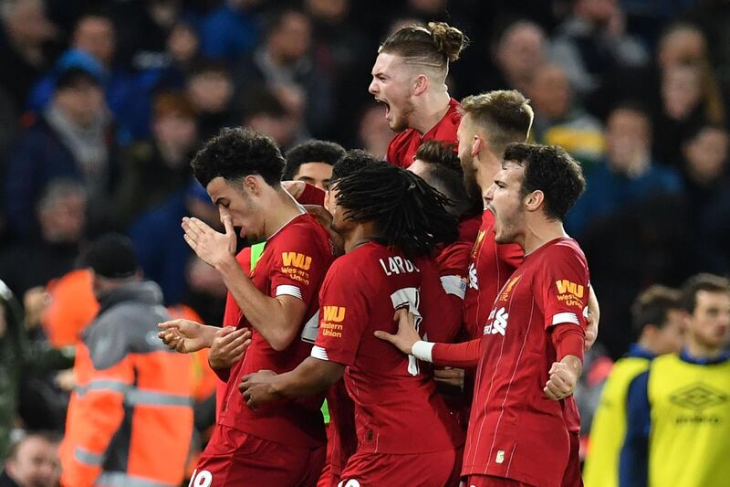 Liverpool celebrate Curtis Jones' goal in the FA Cup third round match against Everton at Anfield on Sunday. AFP