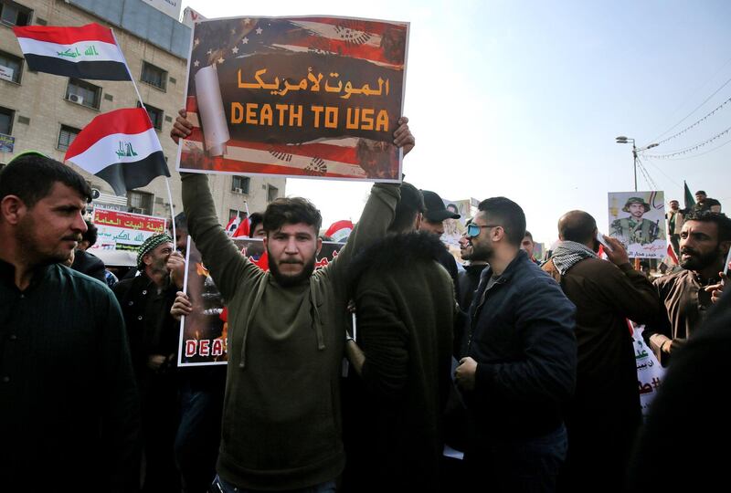 Several thousand Hashed supporters marched into Tahrir Square brandishing sticks, Iraqi flags and the Hashed's logo, a symbol shunned by the vast majority of protesters.