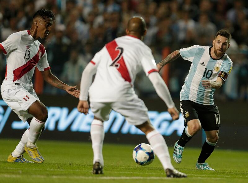 
                  Argentina's Lionel Messi, right, fights for the ball with Peru's Alberto Rodriguez, center, and Renato Tapia during a World Cup qualifying soccer match at La Bombonera stadium in Buenos Aires, Argentina, Thursday, Oct. 5, 2017. (AP Photo/Victor R. Caivano)
               