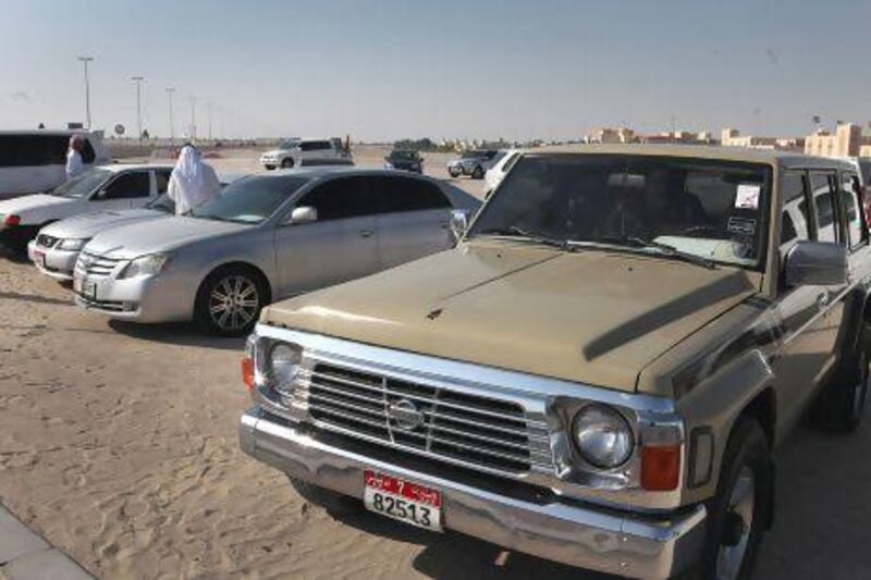 Al Shamkha roundabout turns into a used car sales lot during the weekends where sellers and buyers merge. Delores Johnson / The National