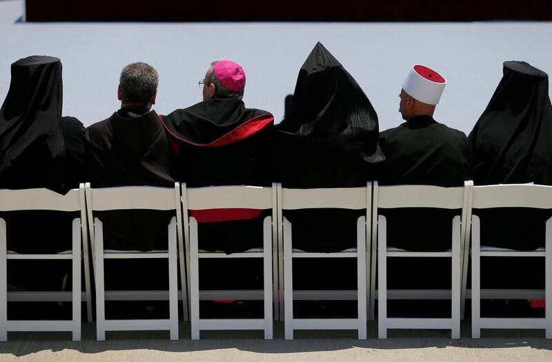 Members of the Christian clergy wait for the arrival of US president Donald Trump and first lady Melania Trump in Tel Aviv, Israel. Reuters