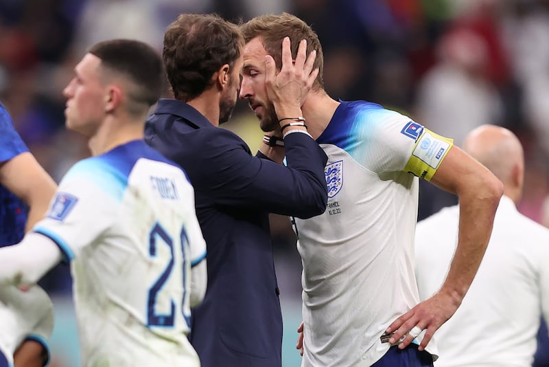 Harry Kane of England is consoled by manager Gareth Southgate after their 2-1 defeat to France. Getty