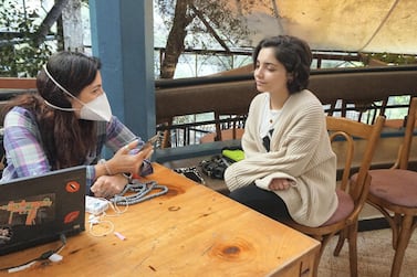 Maya Tabbara sitting with Melissa Fathallah, a volunteer with Beytna Beytak, at Em Nazih hostel in Gemmayze, Beirut. Sunniva Rose for The National  