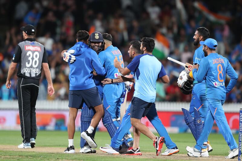 India’s Rohit Sharma, centre, with teammates after hitting the last ball for a six in the super over against New Zealand in the Hamilton T20 seal series victory on Wednesday. AFP
