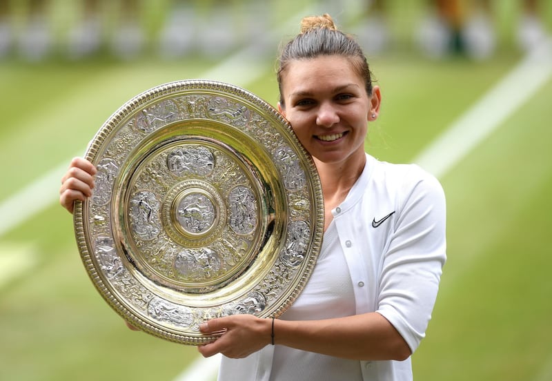 LONDON, ENGLAND - JULY 13: Simona Halep of Romania pose for a photo with the trophy after winning the Ladies' Singles final against Serena Williams of The United States during Day twelve of The Championships - Wimbledon 2019 at All England Lawn Tennis and Croquet Club on July 13, 2019 in London, England. (Photo by Mike Hewitt/Getty Images)