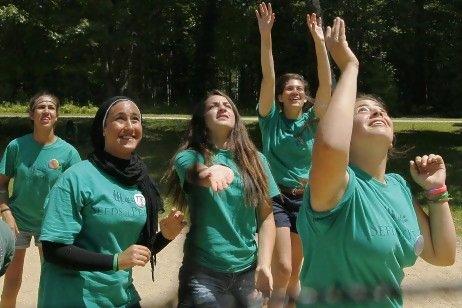 Jordanian, Egyptian and Israeli girls play volleyball at the Seeds of Peace summer camp in Otisfield, Maine. The camp is celebrating its 20th anniversary of bringing kids together from countries at conflict.