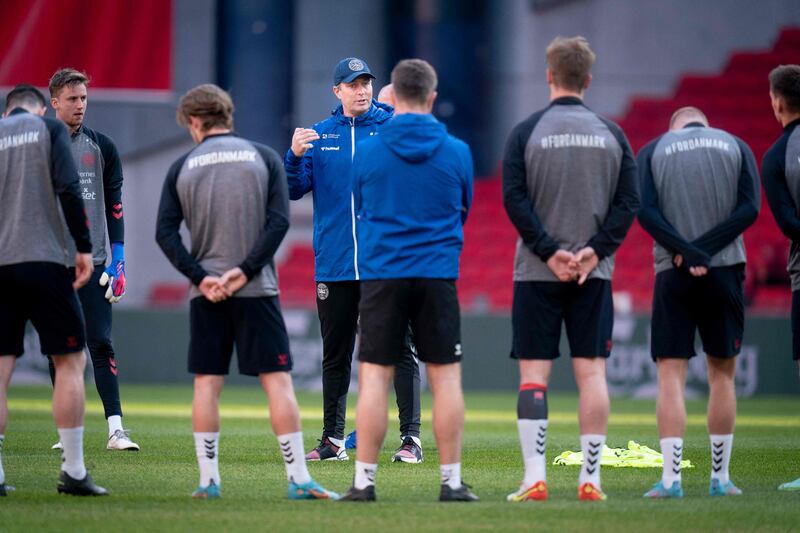 Denmark's coach Kasper Hjulmand speaks to his team during a training session in Copenhagen. AFP